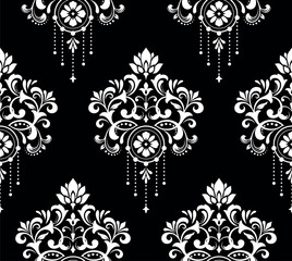 Wallpaper in the style of Baroque. Seamless vector background. White and black floral ornament. Graphic pattern for fabric, wallpaper, packaging. Ornate Damask flower ornament