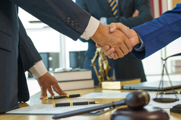 A team of lawyers shares knowledge and discusses difficult cases. from one's conduct Lawyers...