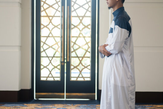Asian muslim man solat and takbir take his hands up. Islam praying