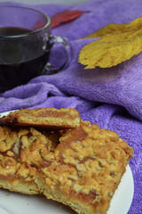 coffee with pie and autumn leaves on a blanket