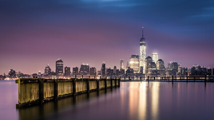 Downtown New York as observed from Jersey City, from across the Hudson River at dawn.