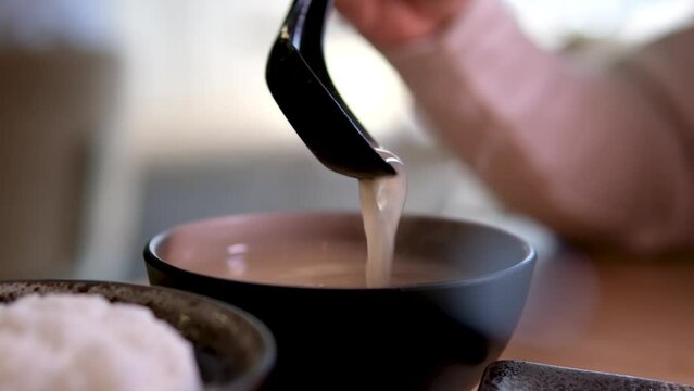  Miso soup is traditional Japanese soup made primarily of miso paste, dashi broth, and additional ingredients such as vegetables, seaweed. and tofu