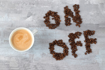 cup of coffee as a switch between ON and OFF beans, gray stone background, morning or waking up...