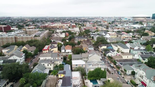 Aerial Forward Shot Of Houses Amidst Roads In Neighborhood Against Sky - New Orleans, Louisiana