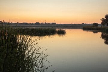 Landscape photo at Dunbar Historical Lake Lubbock Texas of sunrise over water