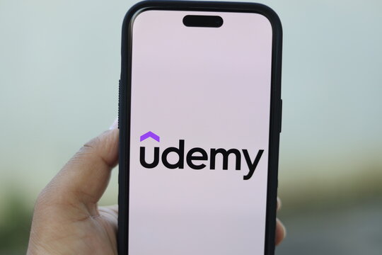 Udemy Logo On A Phone. Concept Of Learning On The Move. Digital Learning Concept. 