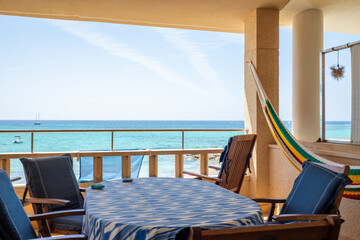 table with chairs on terrace with sea views