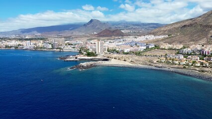 Drone view of many hotels at the beach on the Canary Island of Tenerife - obrazy, fototapety, plakaty