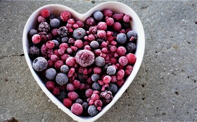 Frozen berries in shape of heart pot