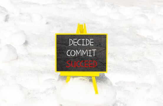 Decide commit succeed symbol. Concept word Decide Commit Succeed on beautiful black chalk blackboard. White snow. Beautiful white snow background. Business decide commit succeed concept. Copy space.