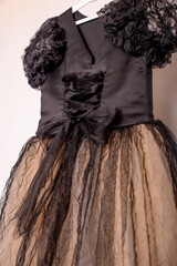 Elegant children’s formalwear – a black and gold dress for a princess-like look.