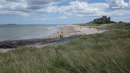 Bamburgh, UK - 14 July, 2023: Bamburgh castle and Northumbrian coast