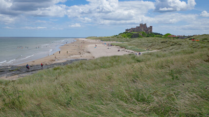 Fototapeta na wymiar Bamburgh, UK - 14 July, 2023: Bamburgh castle and Northumbrian coast