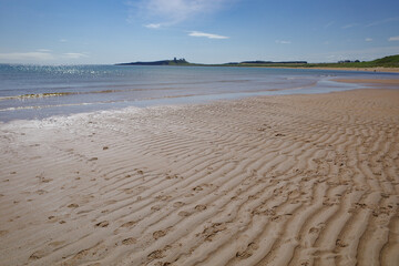Low Newton, UK - 13 July, 2023: Views of Dunstanburgh castle and the Northumbria coast, Low Newton...