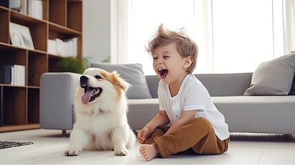 Fototapeta na wymiar A little boy laughing as he plays fetch with his mixed breed puppy in a bright, minimalist living room.