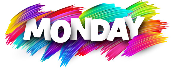 Monday paper word sign with colorful spectrum paint brush strokes over white.