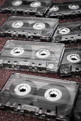 Vintage Cassette Tapes Close-Up on Bold Red Background