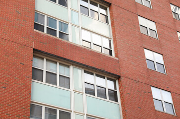 brick building in a vibrant city, symbolizing success and growth in the commercial real estate business. Modern, urban, and prosperous