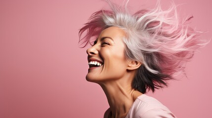 Mature Woman in a Dramatic Hair Flip Moment, Embodying Freedom and Confidence Against a Pastel Pink Studio Background- generative AI, fiction Person