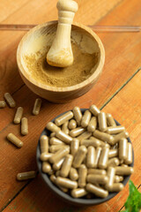 Ashwagandha tablets, mortar for grinding natural raw material, supplement test, laboratory tests