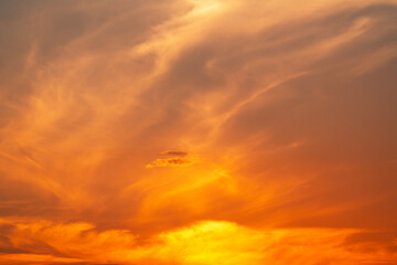 Fototapeta na wymiar Beautiful bright orange sunset sky with clouds. Dramatic sky background.
