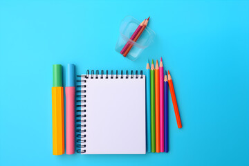 school stationery isolated on blue background with copyspace for text. School concept. Supplies for school