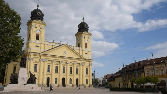 Debrecen main square in summertime Hungary with tourists walking by