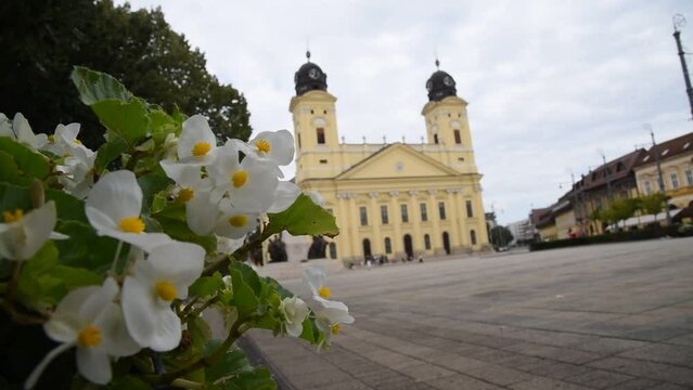 Debrecen main square in summertime Hungary with tourists walking by