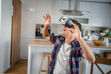 boy caucasian teenager young man enjoy virtual reality VR headset