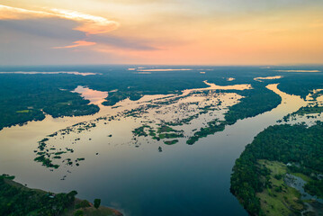 Scenic aerial sunset view of rainforest water jungle in Amazonas Brazil - obrazy, fototapety, plakaty