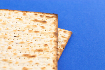 Pieces of Matzah Bread Unleavened Bread on a Blue Background