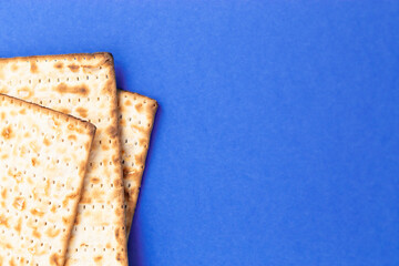 Pieces of Matzah Bread Unleavened Bread on a Blue Background
