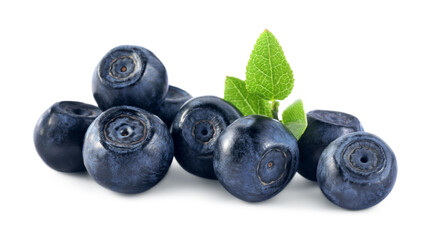 Delicious ripe bilberries and green leaves isolated on white