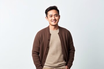 Medium shot portrait photography of a Vietnamese man in his 30s against a white background