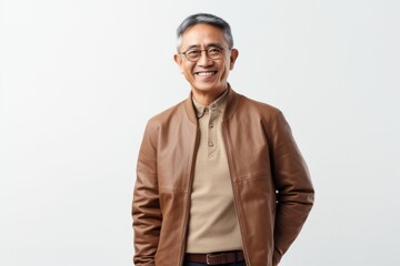 Fototapeta premium Lifestyle portrait photography of a Vietnamese man in his 50s against a white background