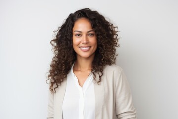 Lifestyle portrait photography of a Peruvian woman in her 30s against a white background