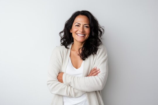 Portrait photography of a happy Peruvian woman in her 40s against a white background