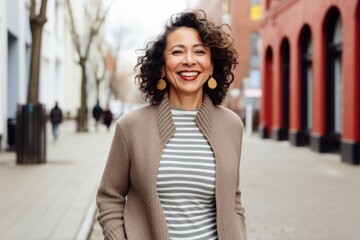 Fototapeta premium Medium shot portrait photography of a Peruvian woman in her 50s against a white background
