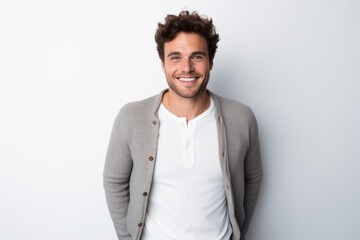 Lifestyle portrait photography of a French man in his 20s against a white background