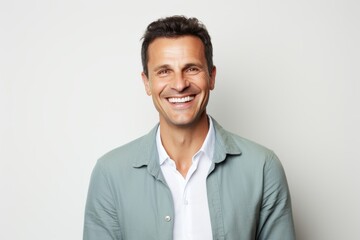 Portrait photography of a happy Italian man in his 40s against a white background
