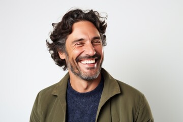 Lifestyle portrait photography of a happy Italian man in his 40s against a white background