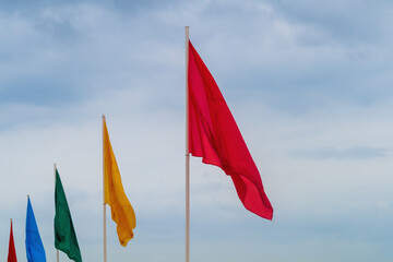 Flags of different colors stretching into the horizon, decoration of beaches and other tourist areas on the eve of the opening of the tourist season and receiving guests from abroad, hospitality