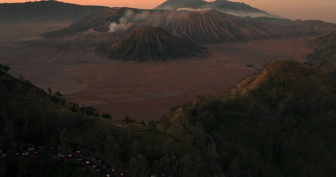 Aerial view 4k by drone of Bromo Mountain from King Kong Hill, Indonesia. Aerial view of Mount Bromo volcano on sunrise. Bromo Mount on Twilight at Kabupaten Probolinggo, Jawa Timur, Indonesia.