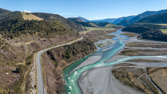 Aerial river forest and mountain scenery of the stunning road through the valley leading into the alpine Lewis Pass