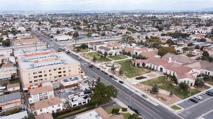 Fototapeta na wymiar South Gate, California, USA - February 11, 2023: Traffic passes through the urban core of South Gate.