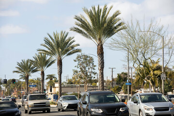 South Gate, California, USA - February 11, 2023: Traffic passes through the urban core of South Gate.