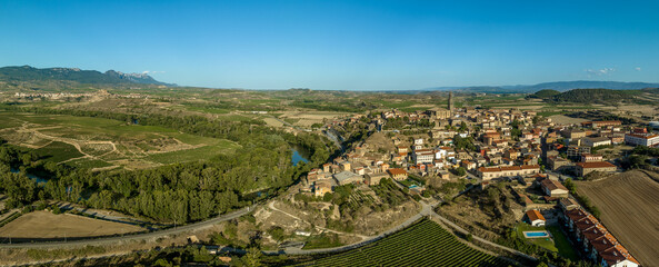 Fototapeta na wymiar Aerial panoramic view of Briones, medieval hilltop village with Gothic church and ruined castle above the Ebro river in Rioja Spain