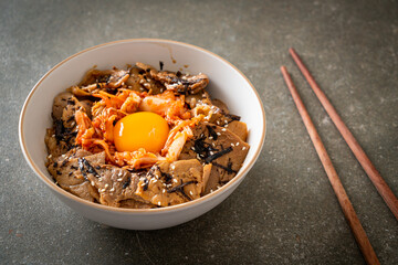 pork bulgogi rice bowl with kimchi and Korean pickled egg