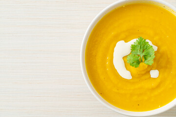 pumpkin soup in white bowl