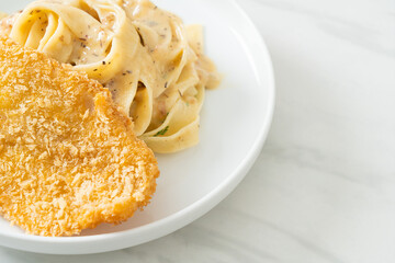 fettuccine pasta white cream sauce with fried fish